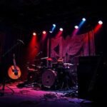 Image of AI Thumbnail: The Warning Photo Gallery: A Lens on Music’s Cultural Tapestry